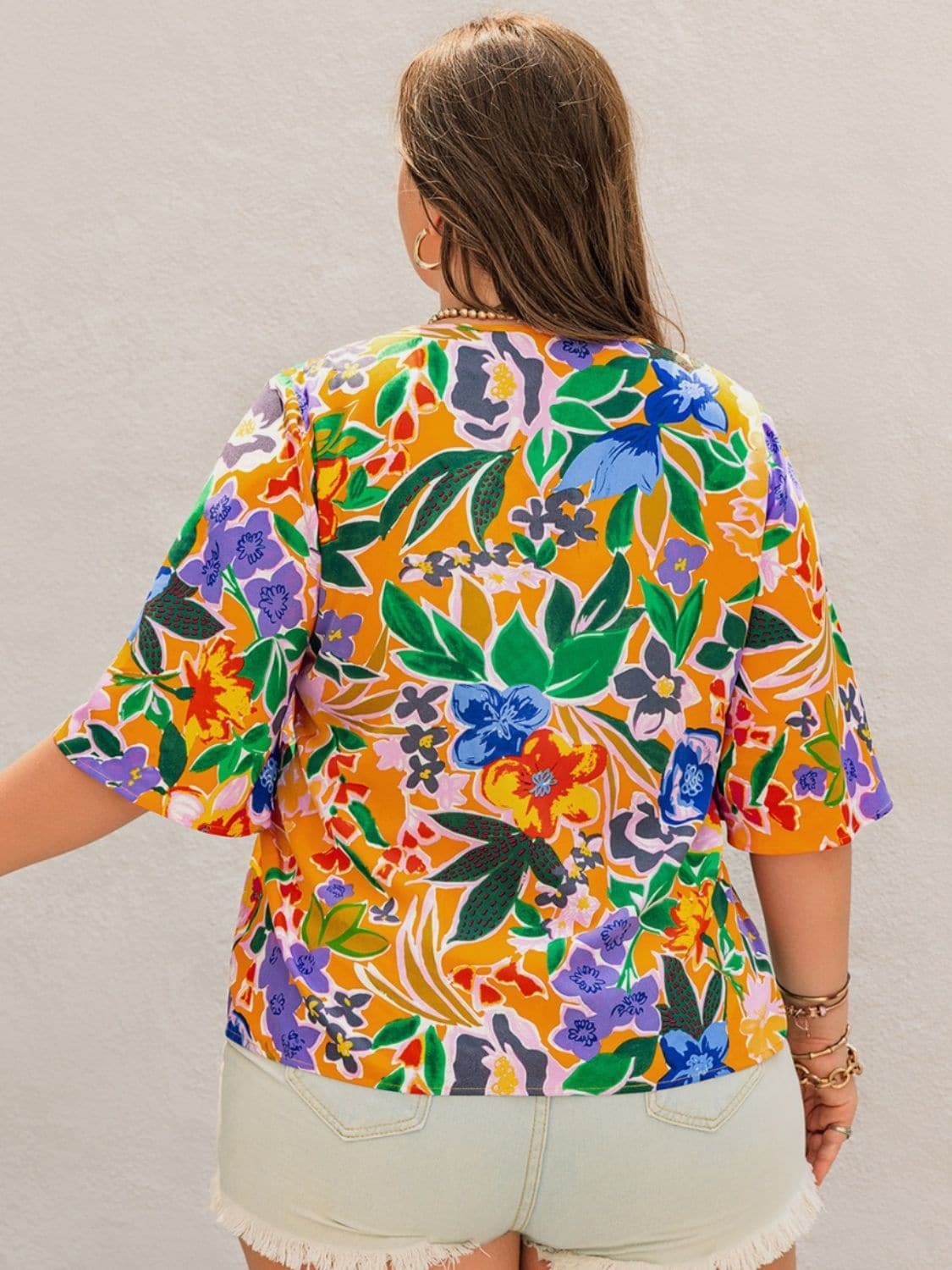 Plus Size Printed Tie Neck Half Sleeve Blouse.