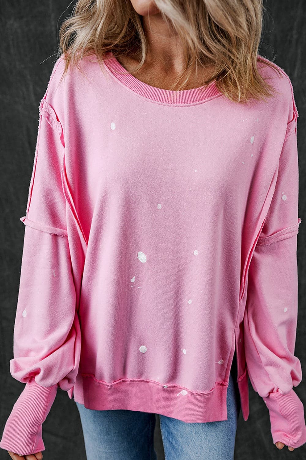 Exposed Seam Round Neck Long Sleeve Sweatshirt.