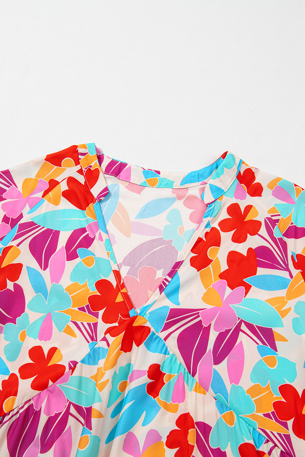 Floral V-neck plus-size tiered dress in vibrant hues