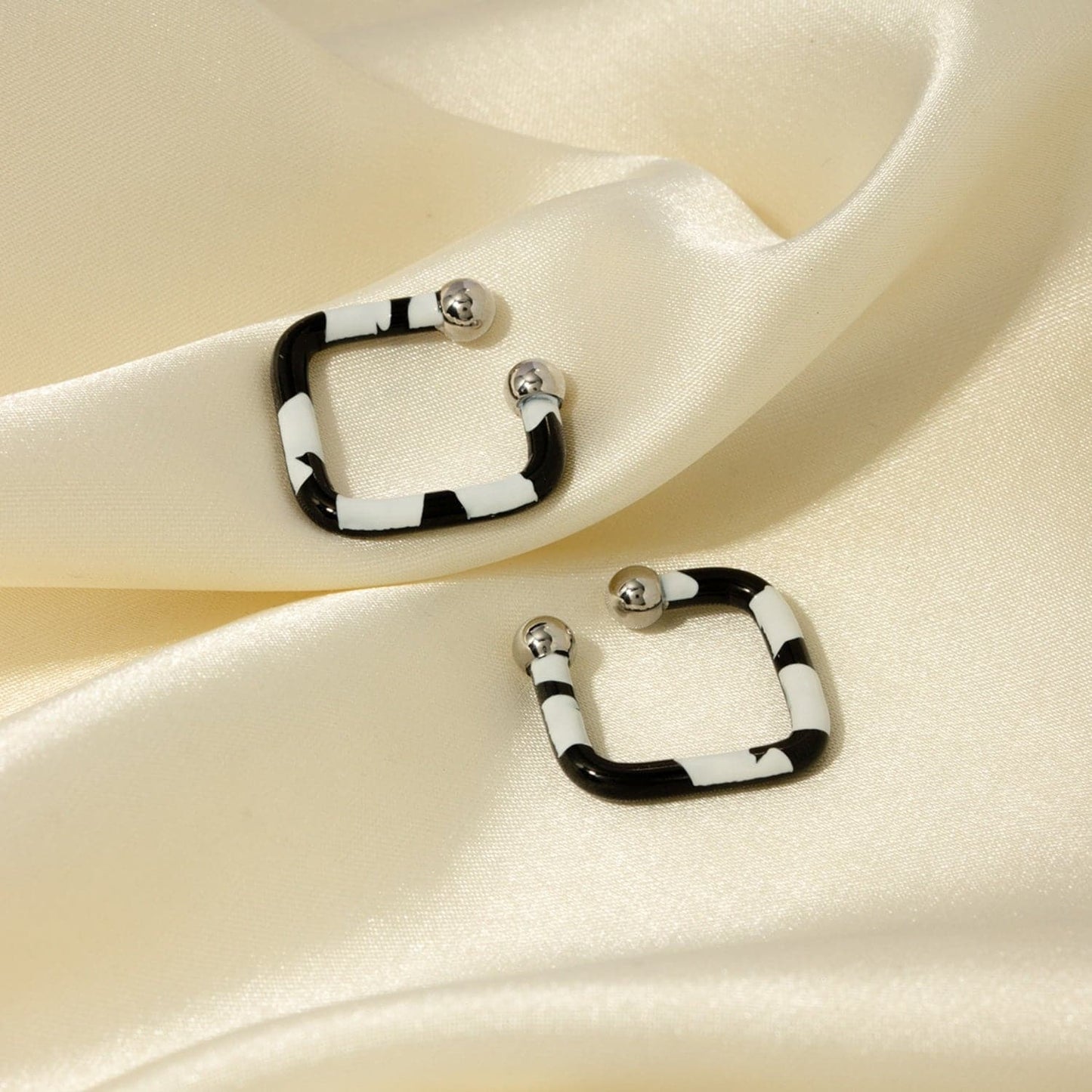 Stainless Steel Oil Drip Cuff Earrings.