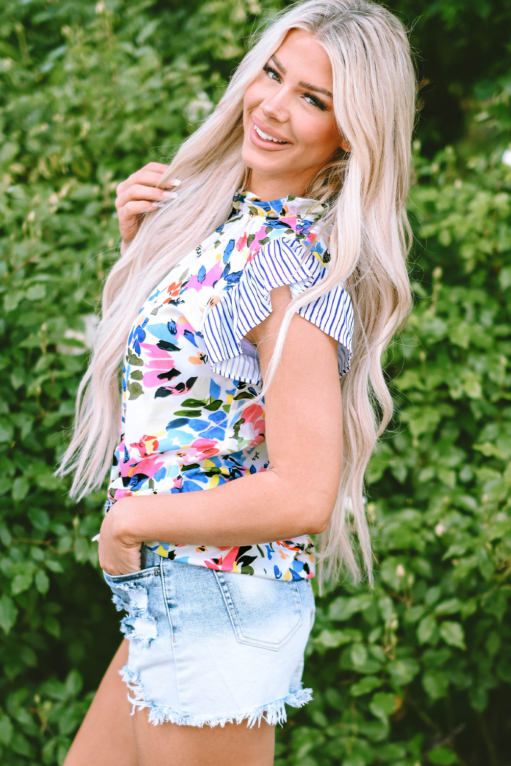 Charming light blue floral blouse with ruffled sleeves and striped accents