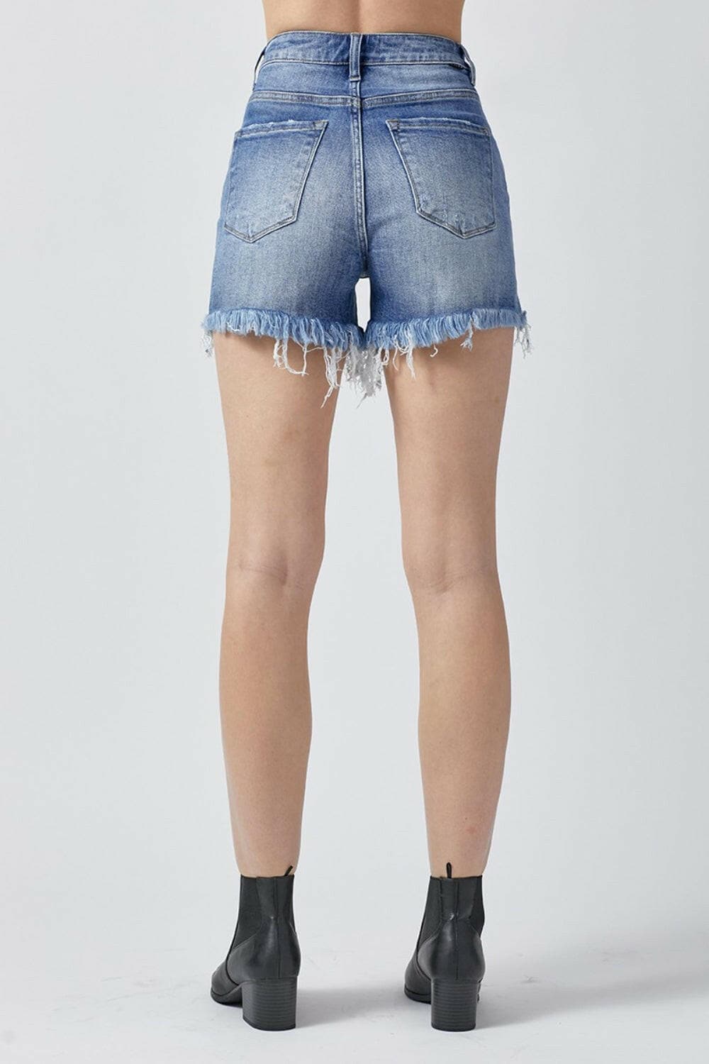 RISEN Raw Hem Asymmetrical Waist Denim Shorts.