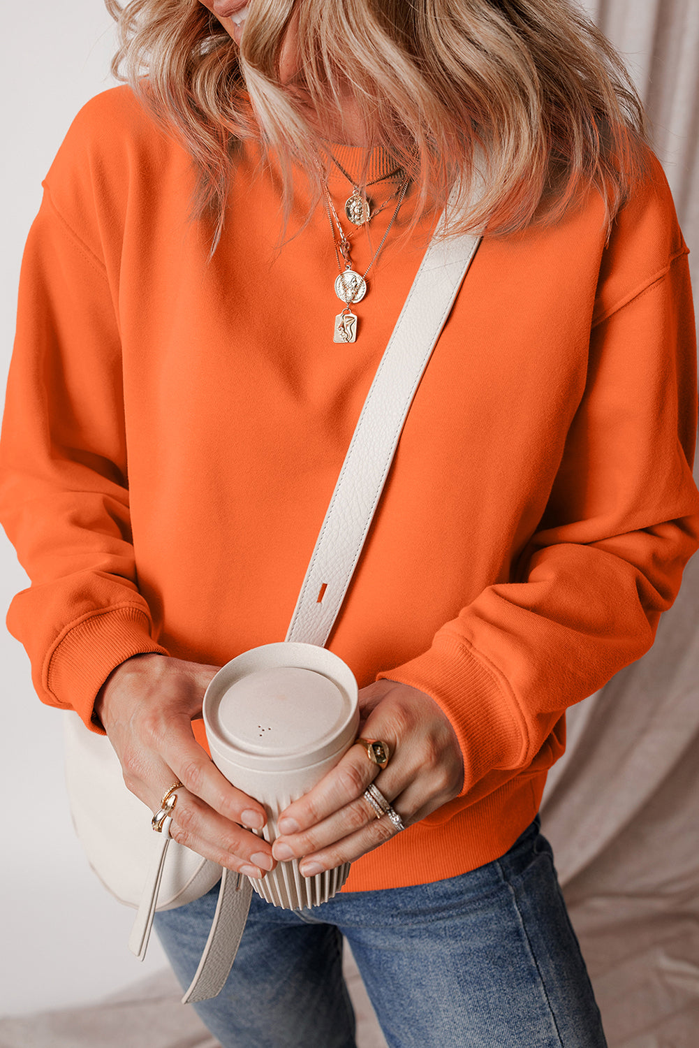 Cozy russet orange fleece-lined sweatshirt with drop shoulders