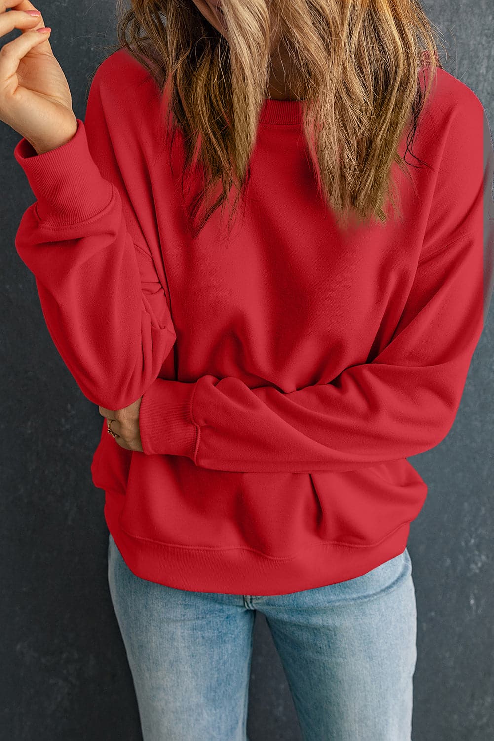 Round Neck Dropped Shoulder Sweatshirt.