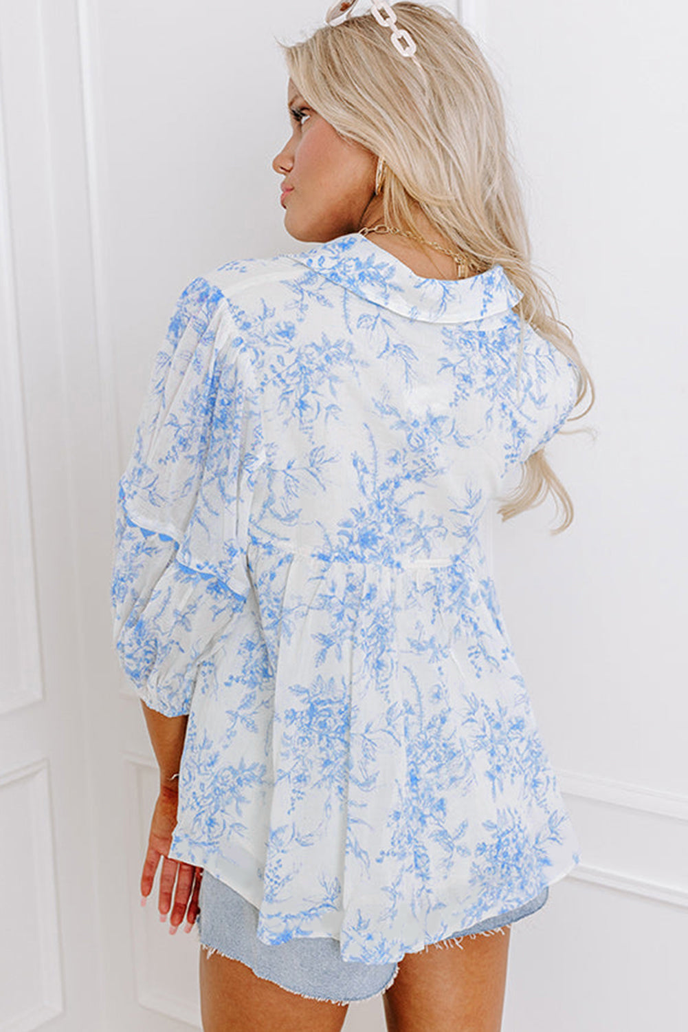 Chic sky blue floral blouse with tied collar and 3/4 sleeves