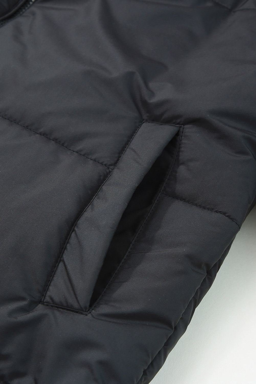 Sleek black winter puffer coat