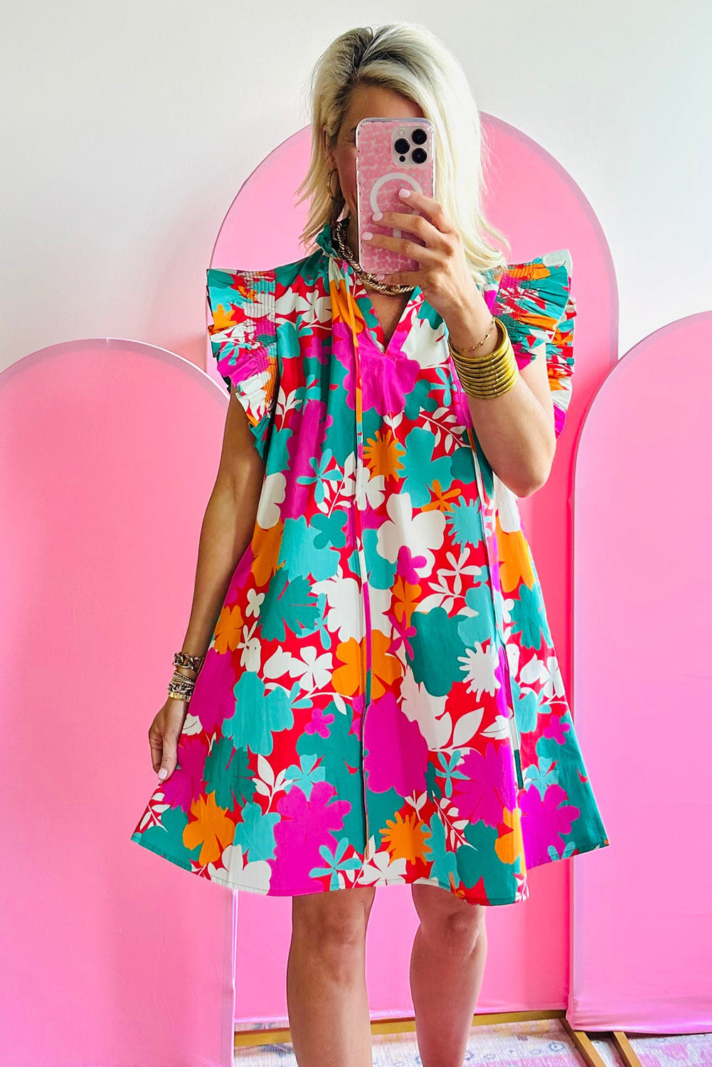 Vibrant floral tie neck mini dress with flutter sleeves