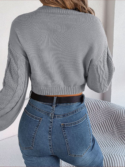 Cable-Knit Round Neck Cropped Sweater.