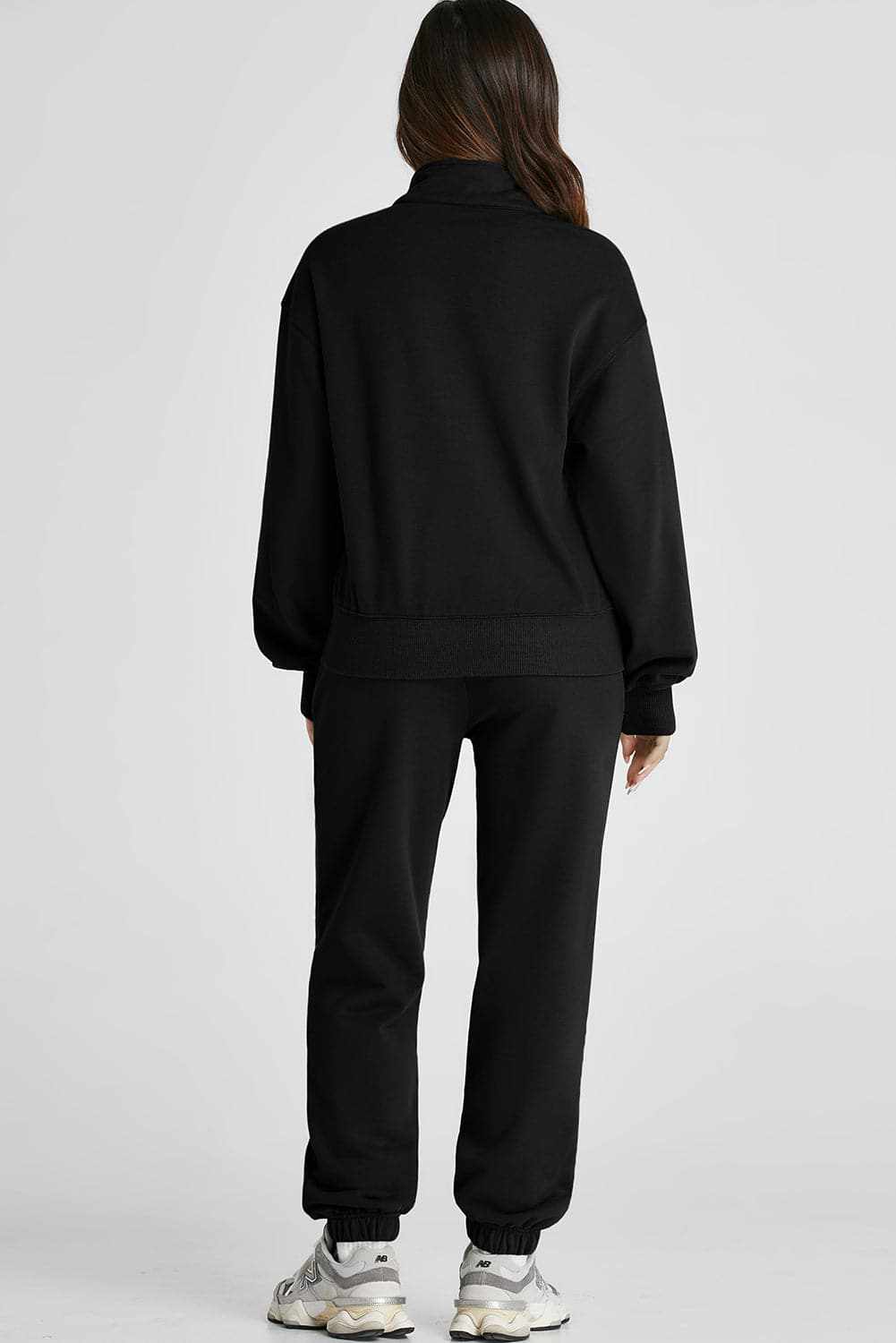 Half zip loungewear set with joggers in black, polyester and cotton blend, back view.