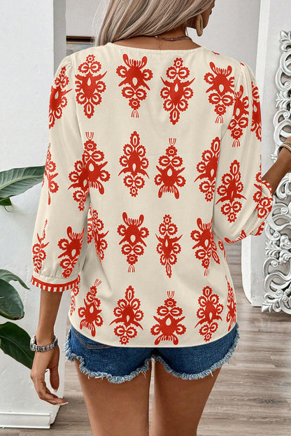 Chic orange geometric print V-neck blouse with 3/4 sleeves