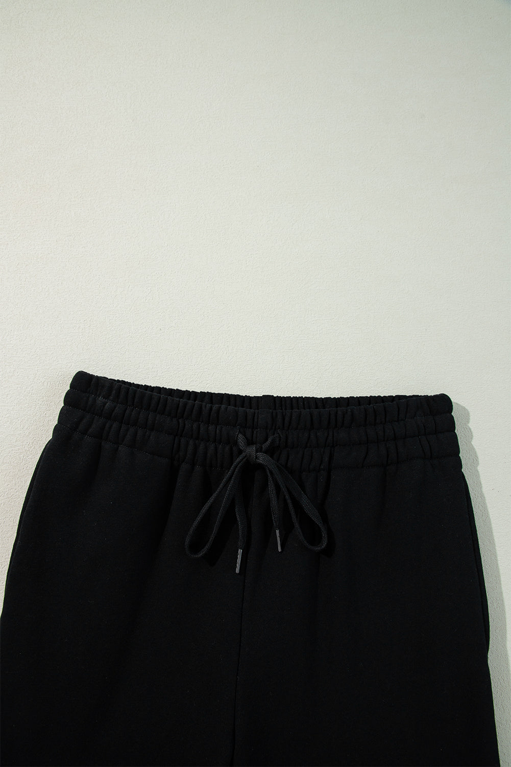 Cozy black fleece-lined casual pants with adjustable drawstring waist