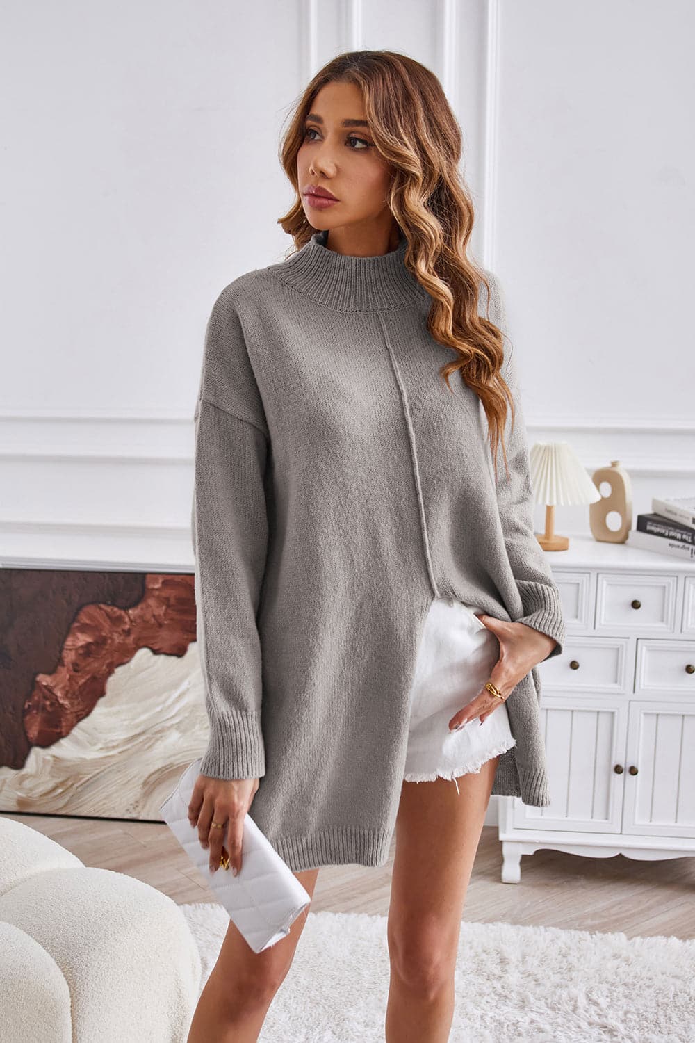 Exposed Seam Mock Neck Slit Sweater.