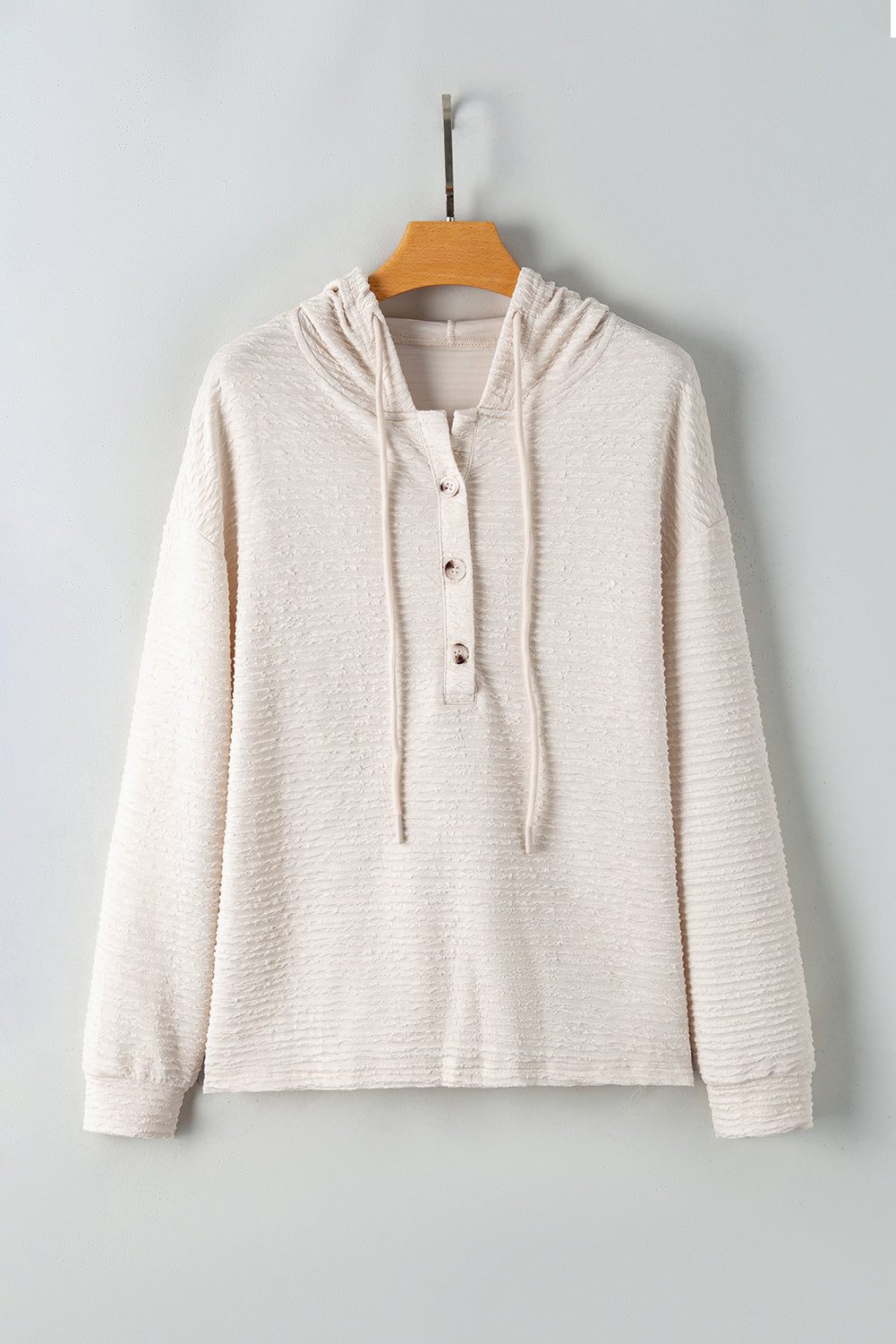 Apricot textured drawstring hoodie with buttoned neckline