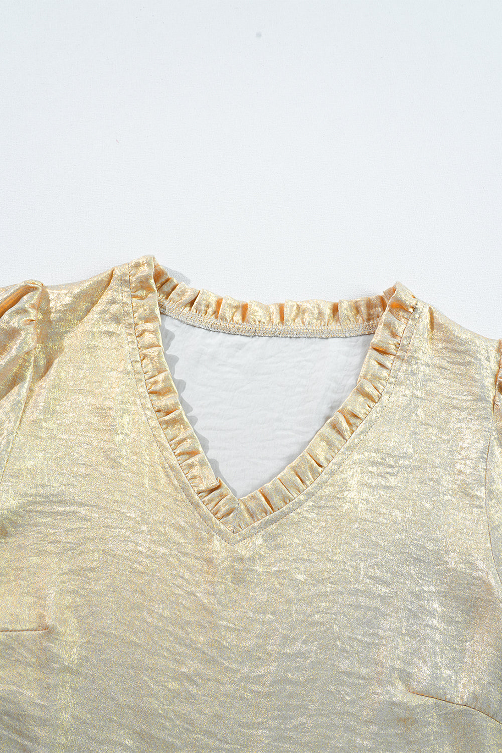 Gold metallic frilled V neck puff sleeve babydoll blouse, 100% polyester, elegant and fashionable design.