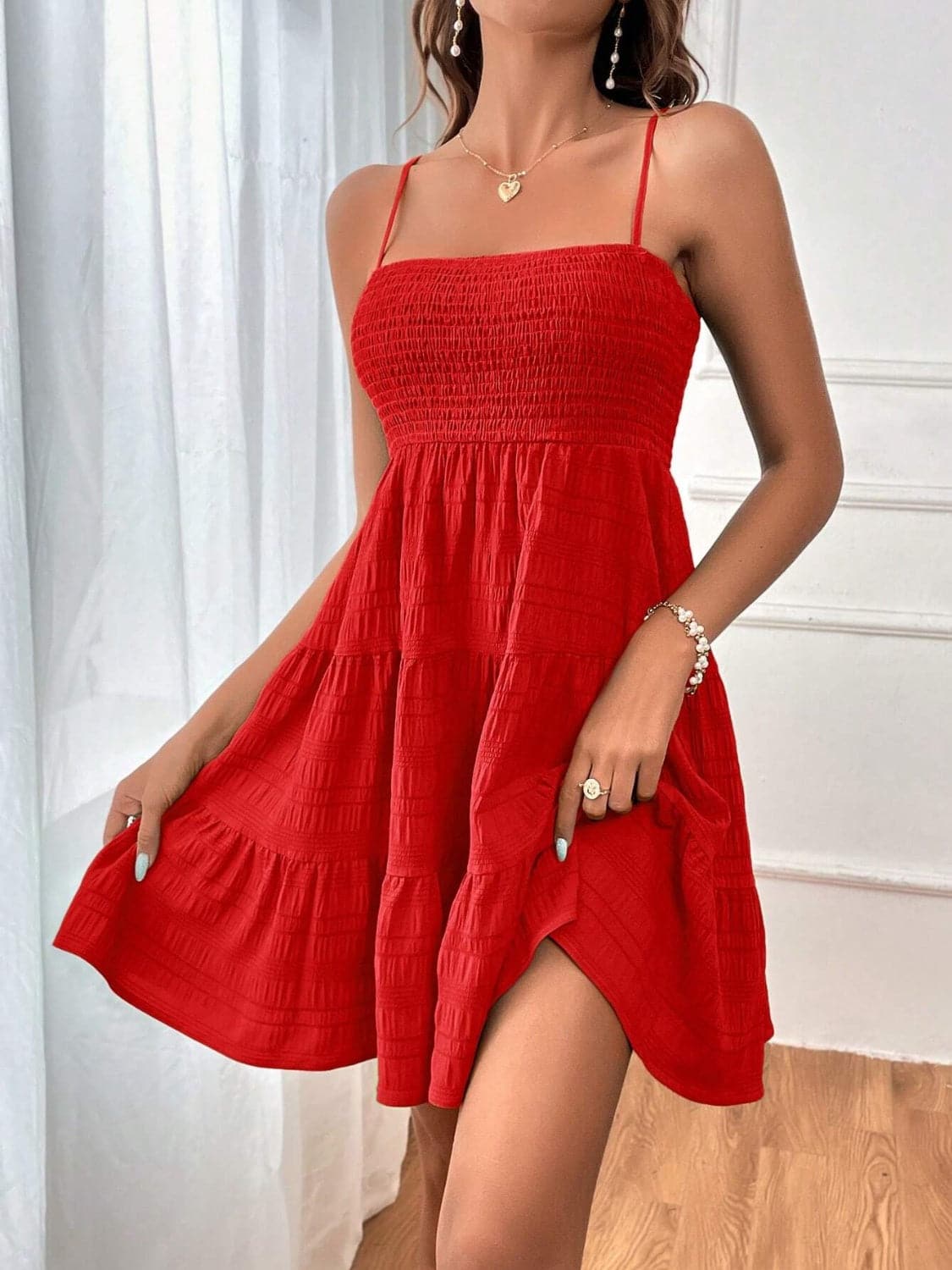 Smocked Tiered Sleeveless Mini Dress.