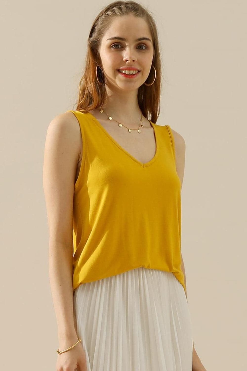 Ninexis Full Size V-Neck Curved Hem Tank.