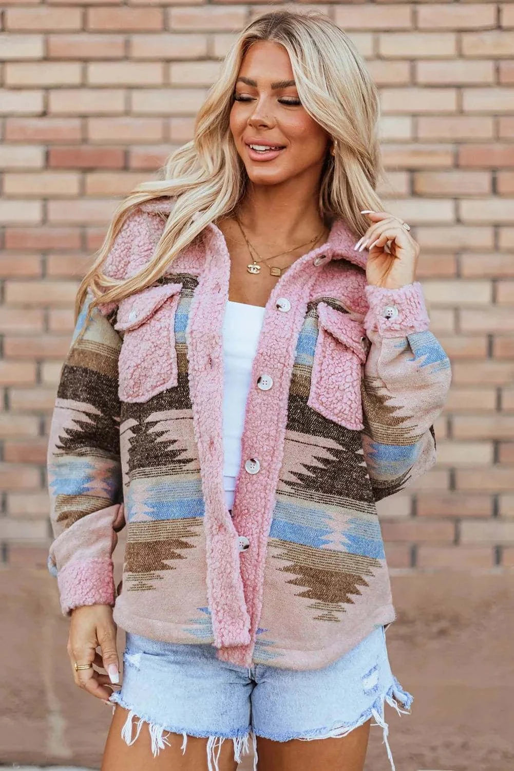 Stylish long sleeve jacket in pink and blue pattern, buttoned, made of 100% polyester.