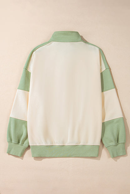 Laurel green colorblock patchwork sweatshirt with buttoned collar and kangaroo pocket