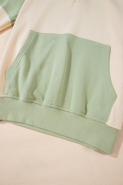 Laurel green colorblock patchwork sweatshirt with buttoned collar and kangaroo pocket