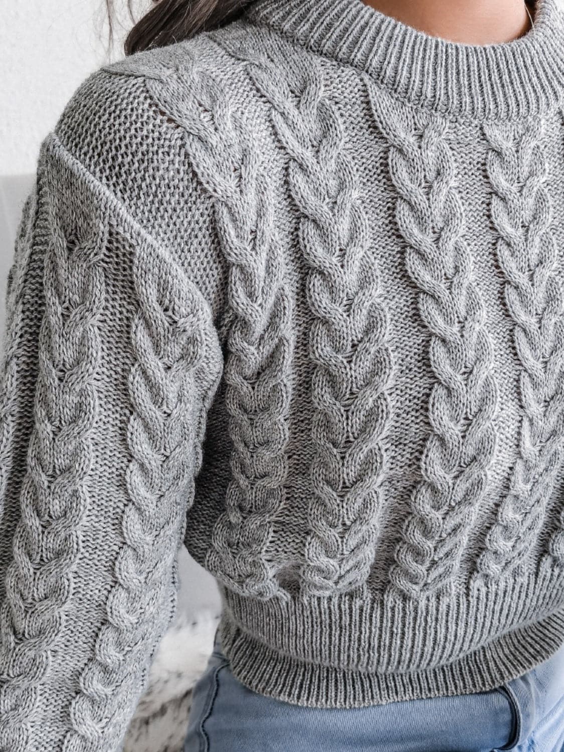 Cable-Knit Round Neck Sweater.