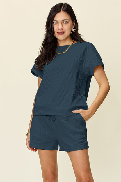 Double Take Full Size Texture Short Sleeve T-Shirt and Drawstring ShorFeatures: Drawstring
Number of pieces: Two-piece
Stretch: Slightly stretchy
Material composition: 97% polyester, 3% spandex
Care instructions: Machine wash cold. TumLove Salve Full Size Texture Short SleeveTwo-Piece Sets