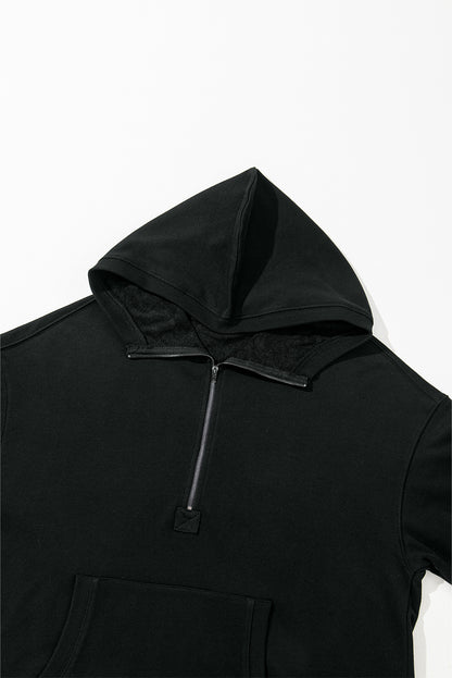 Cozy black oversized hoodie with kangaroo pocket and half zipper