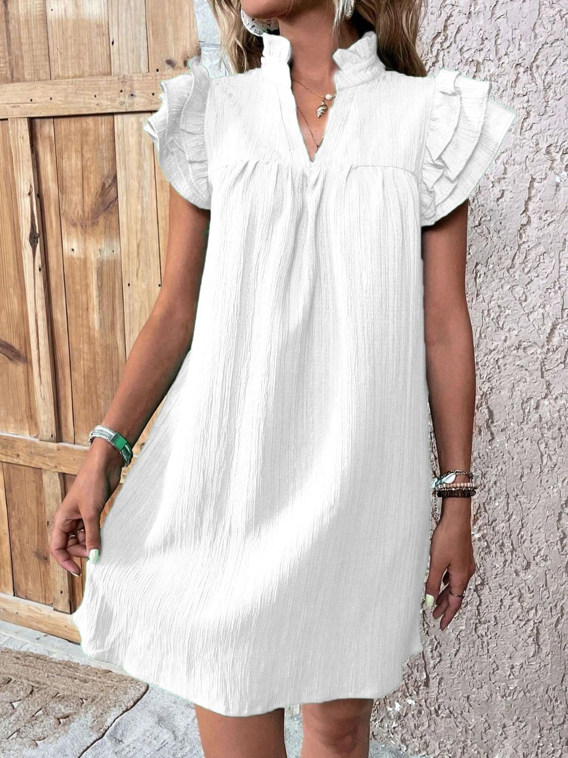 Ruffled Notched Cap Sleeve Mini Dress.