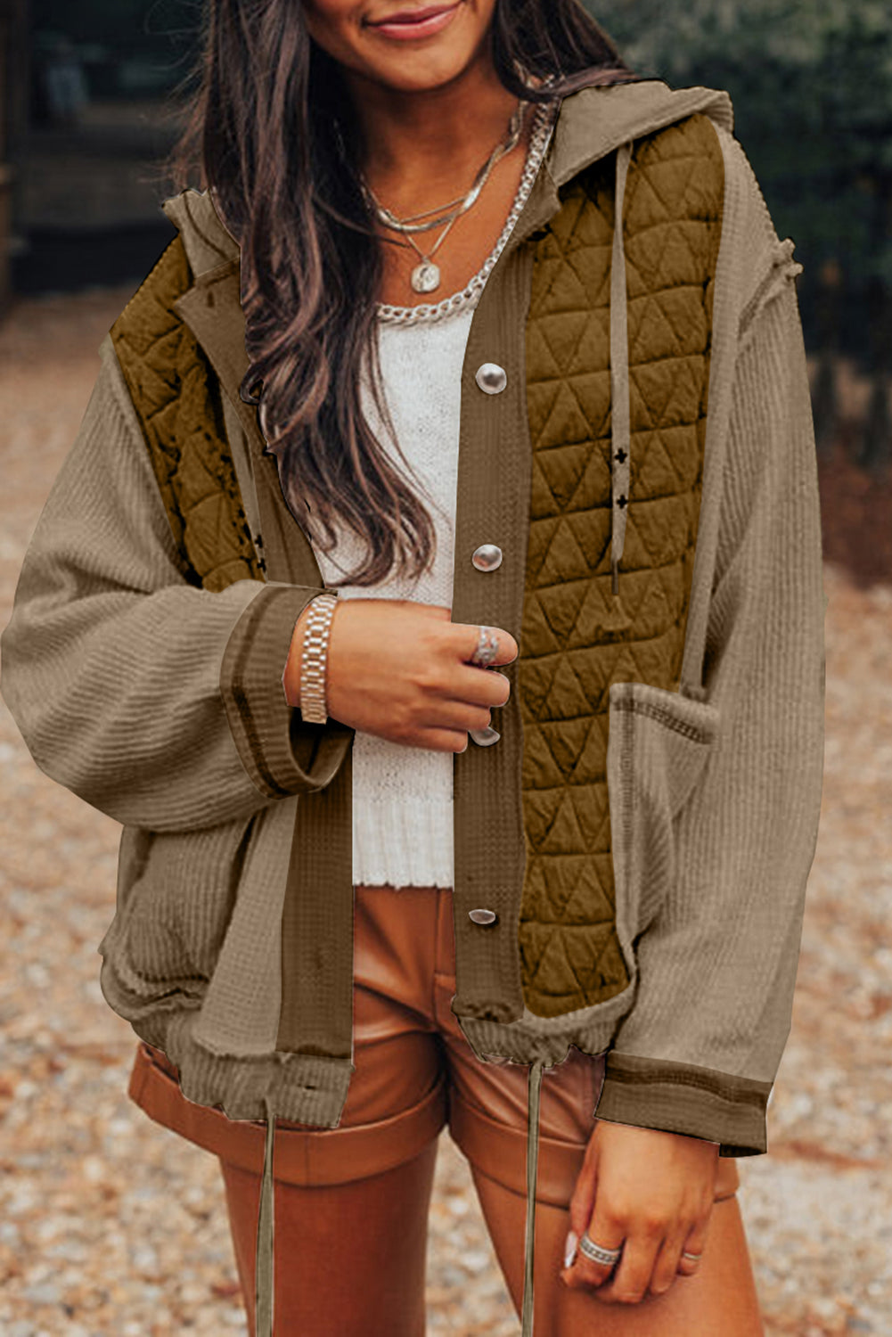 Cozy jungle green hooded jacket with quilted patchwork design.