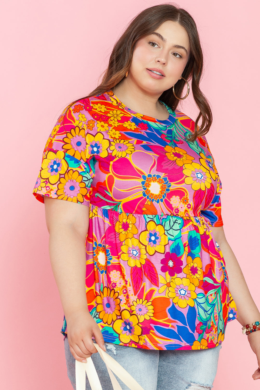 Chic pink floral babydoll blouse in plus sizes with short sleeves