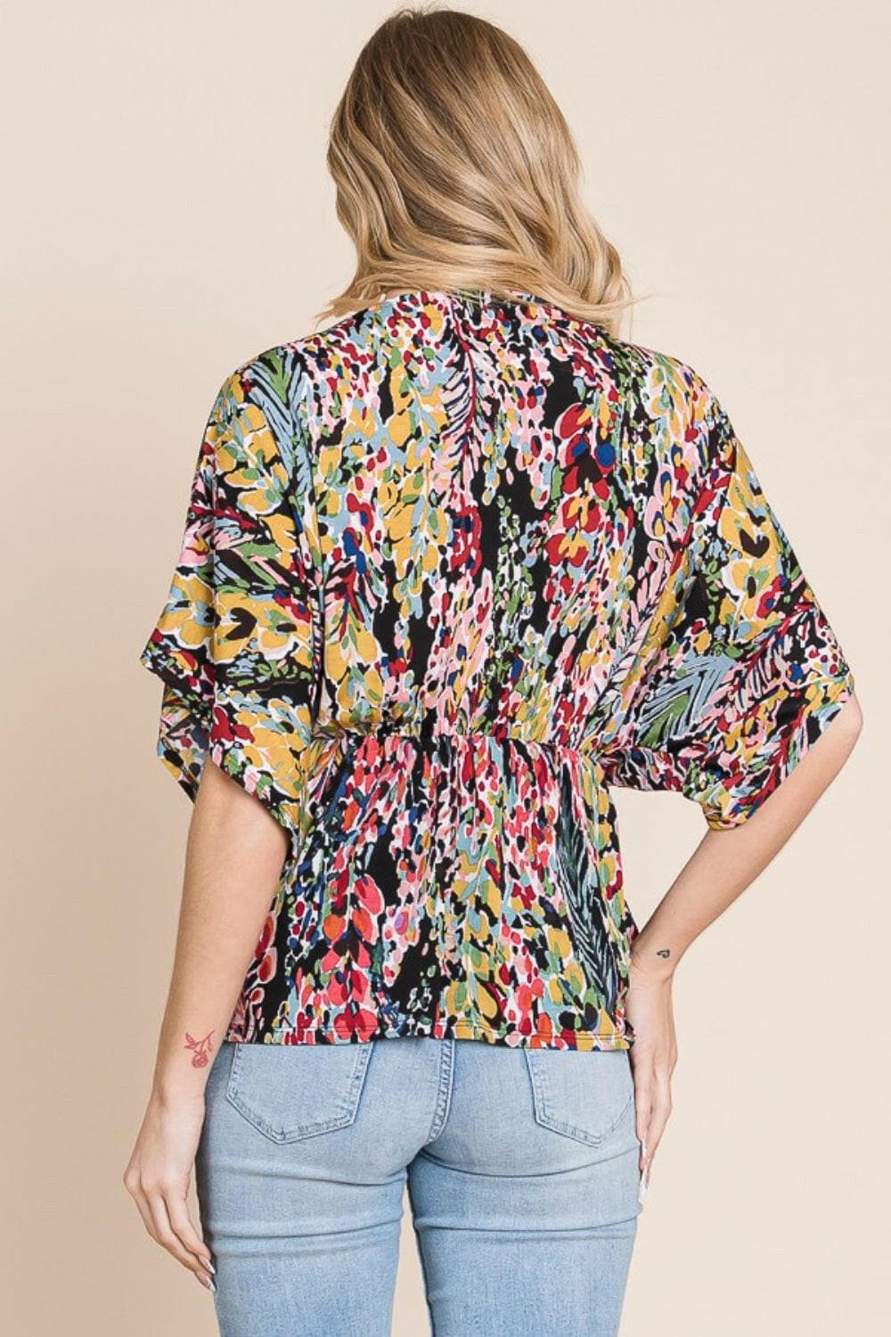 BOMBOM Printed Surplice Peplum Blouse.