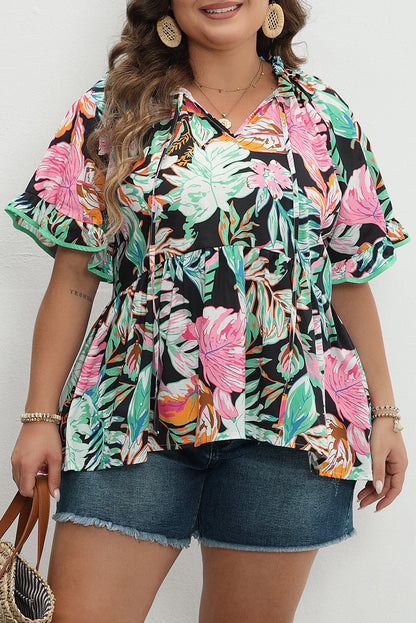 Elegant black tropical print blouse with ruffled sleeves and flowy design