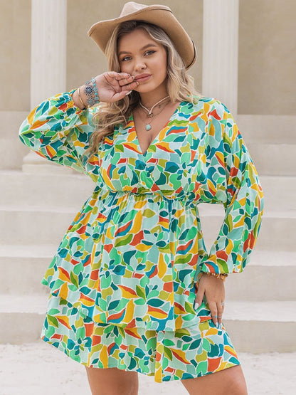 Plus Size Printed Surplice Long Sleeve Mini Dress.