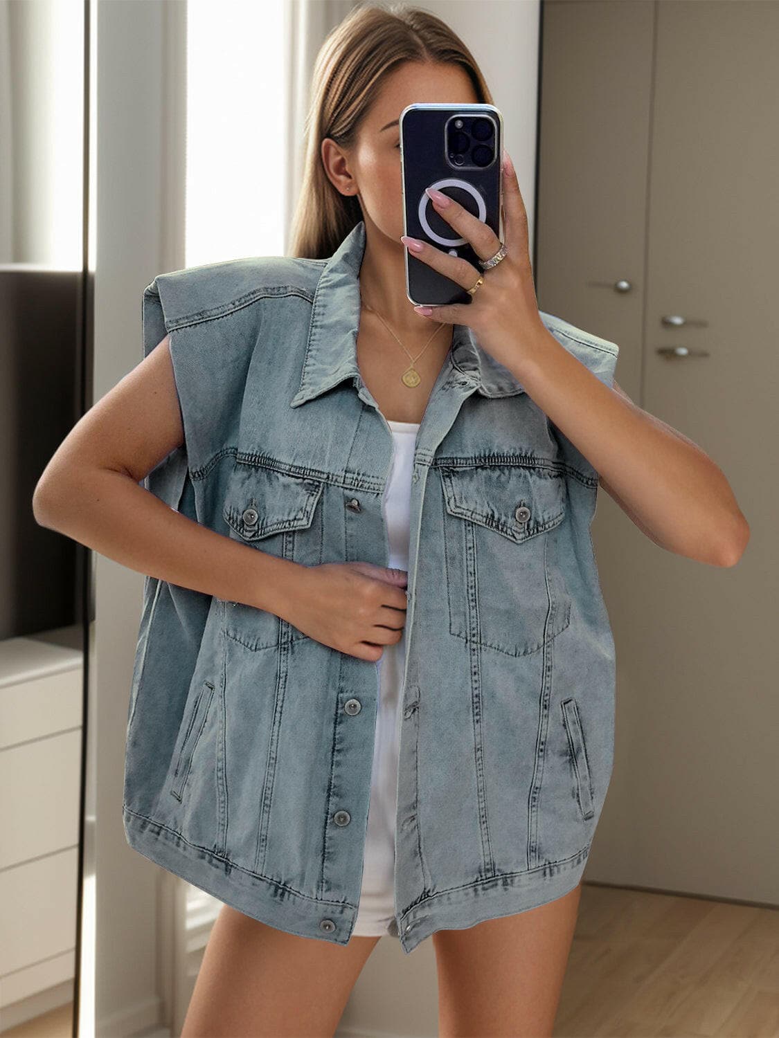 Cap sleeve denim jacket with pockets and button-up front.