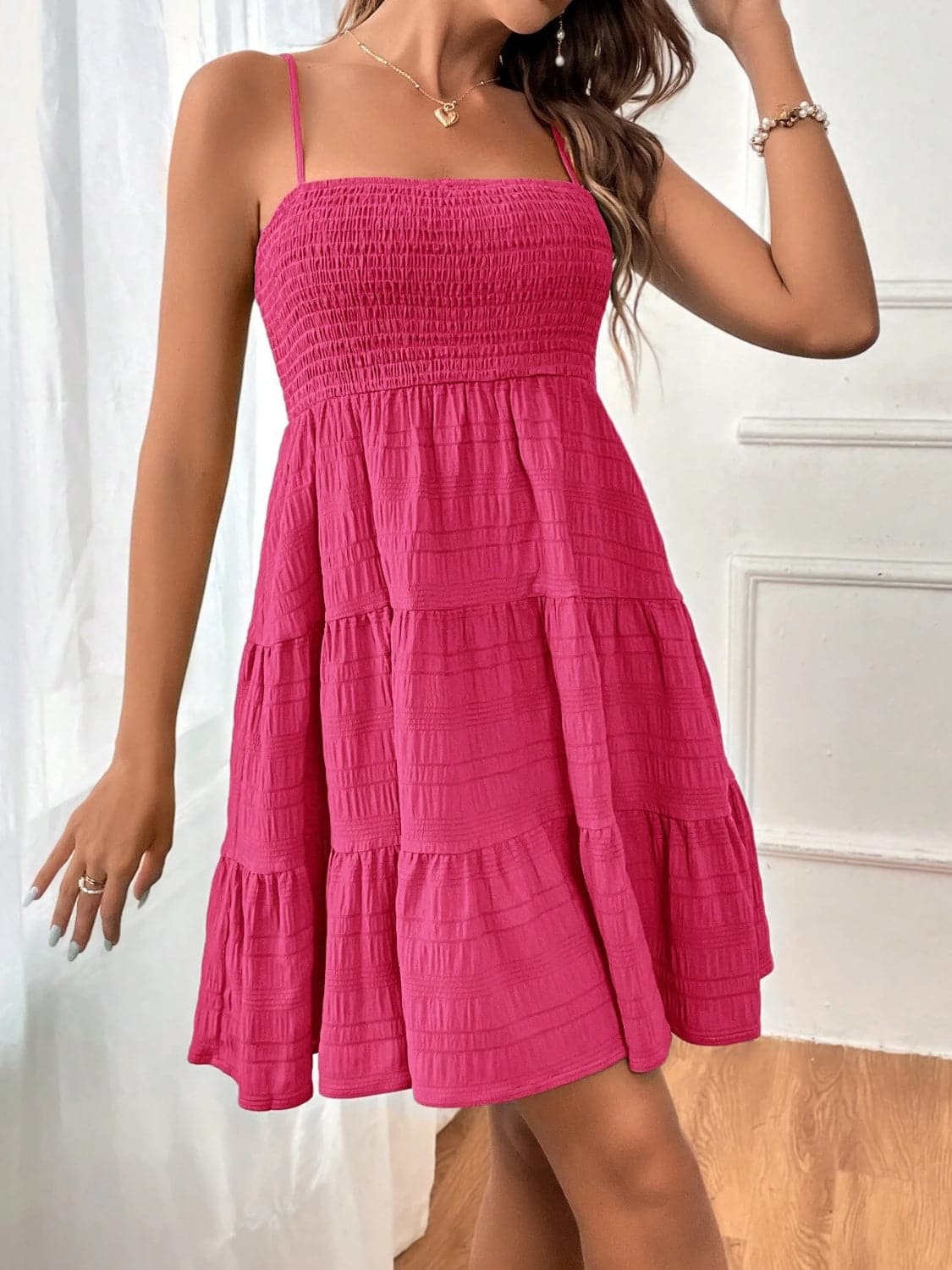 Smocked Tiered Sleeveless Mini Dress.