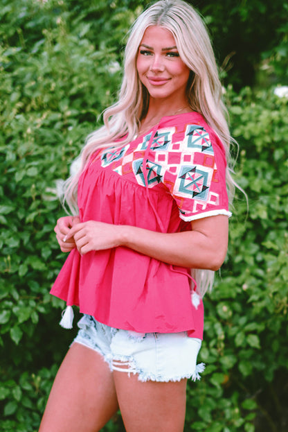 Chic strawberry pink geometric embroidered blouse with tassel tie neckline