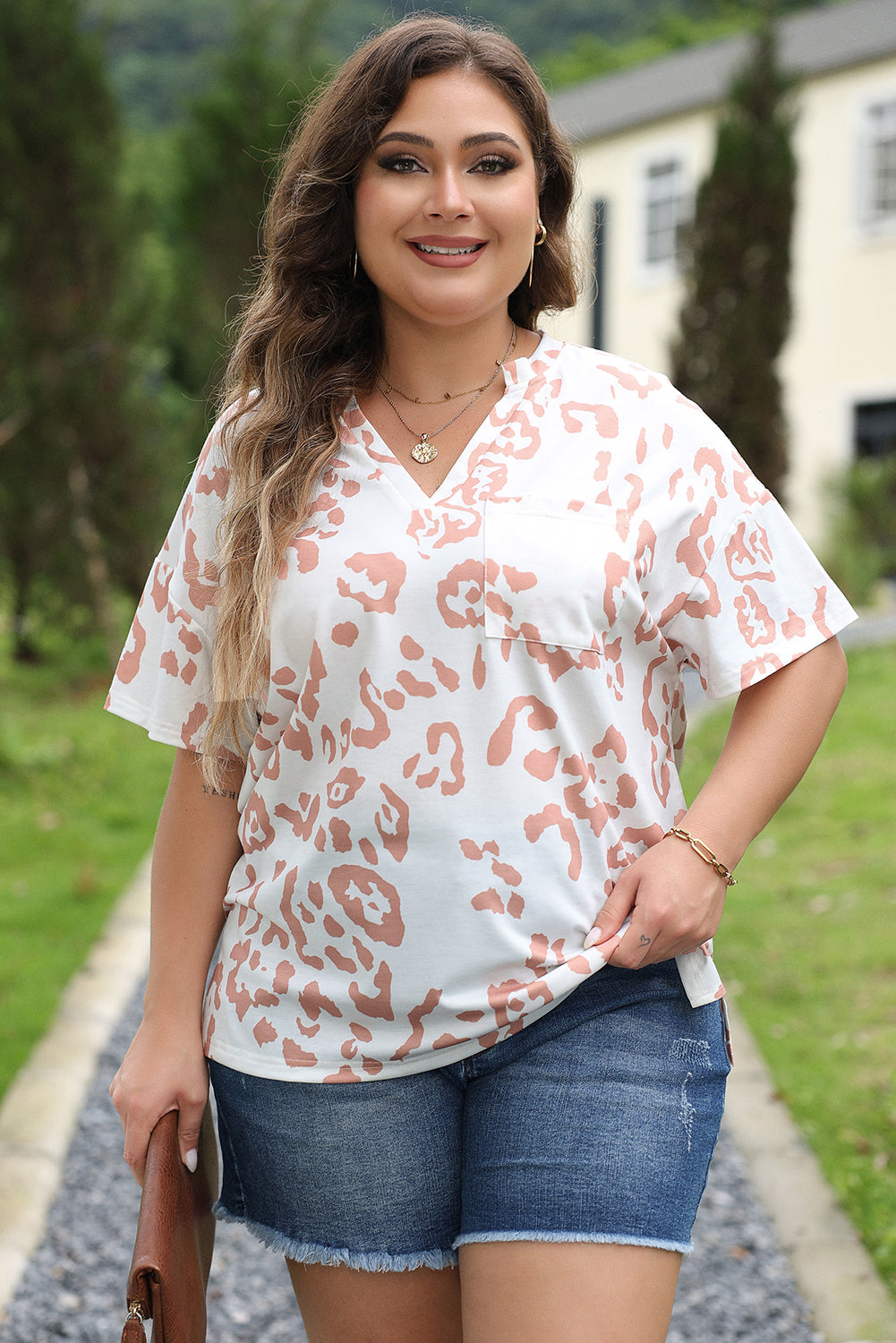 Chic white plus size leopard print v-neck top for effortless style