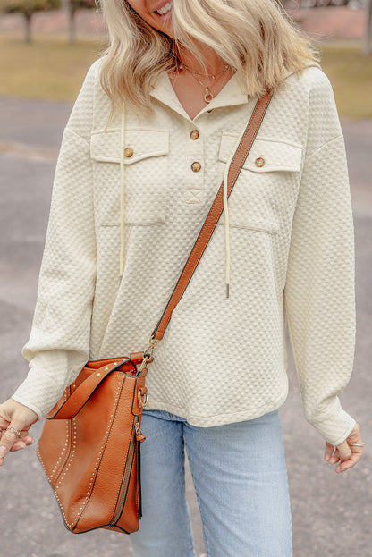 Chic apricot hoodie with buttoned neckline and functional pockets