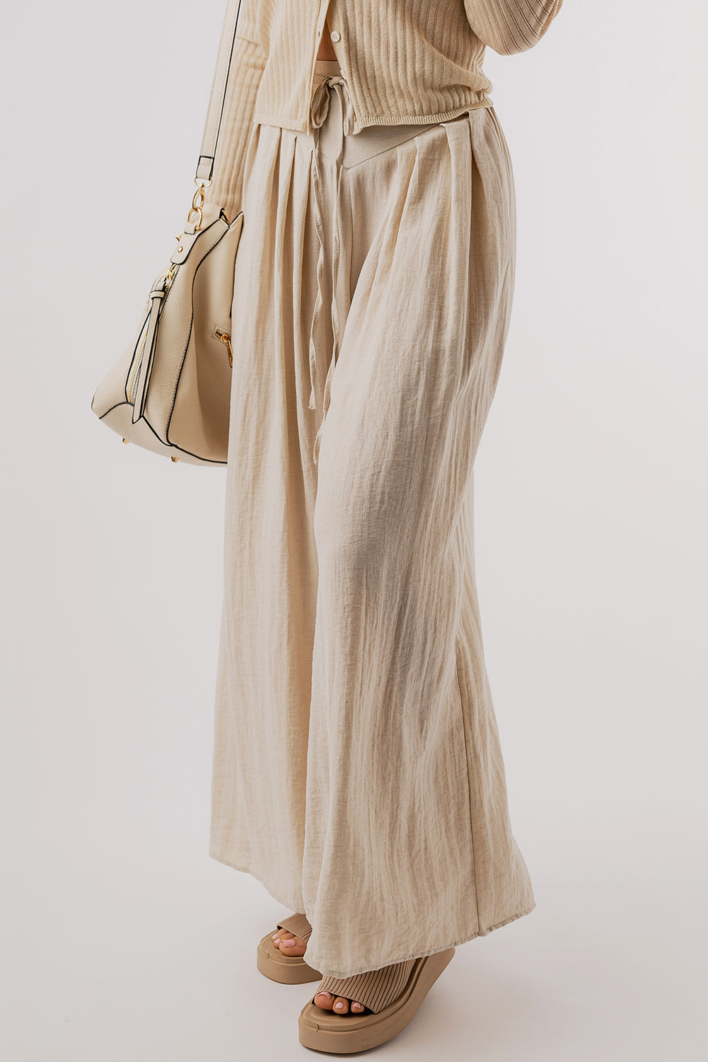 Beige high-waisted wide-leg trousers