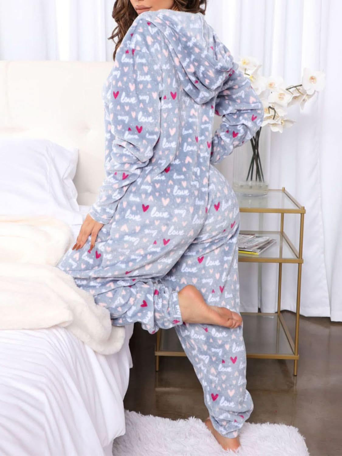 Chic printed hooded jumpsuit with pockets and stretch comfort