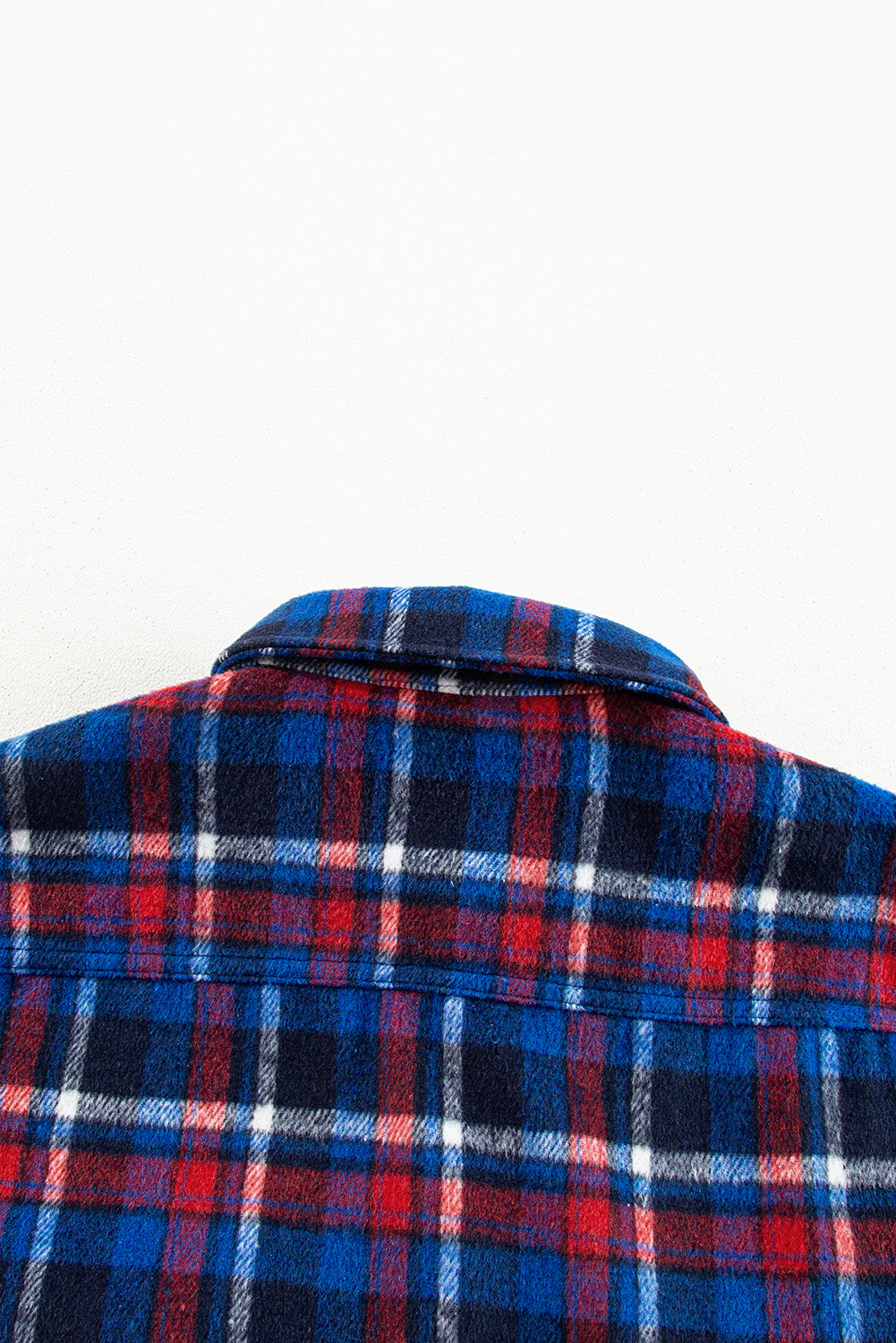 Navy plaid button-up shacket with flap pockets