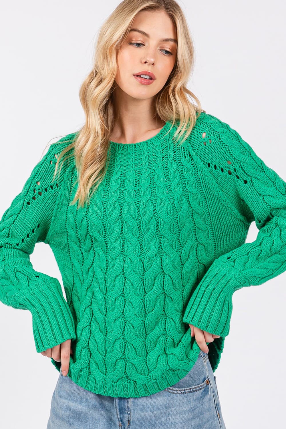 Cozy cable knit oversized sweater with boat neckline