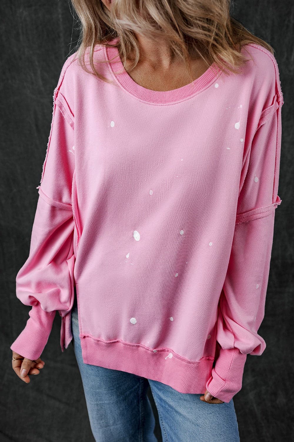 Exposed Seam Round Neck Long Sleeve Sweatshirt.