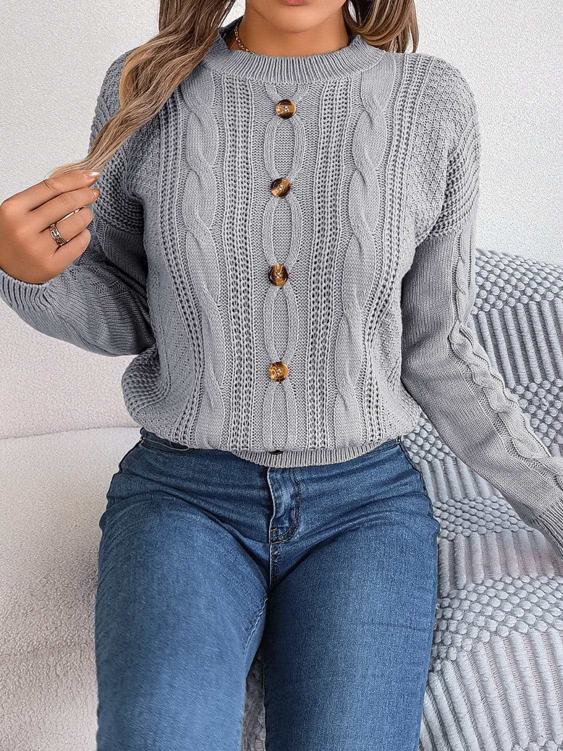 Cable-Knit Buttoned Round Neck Sweater.