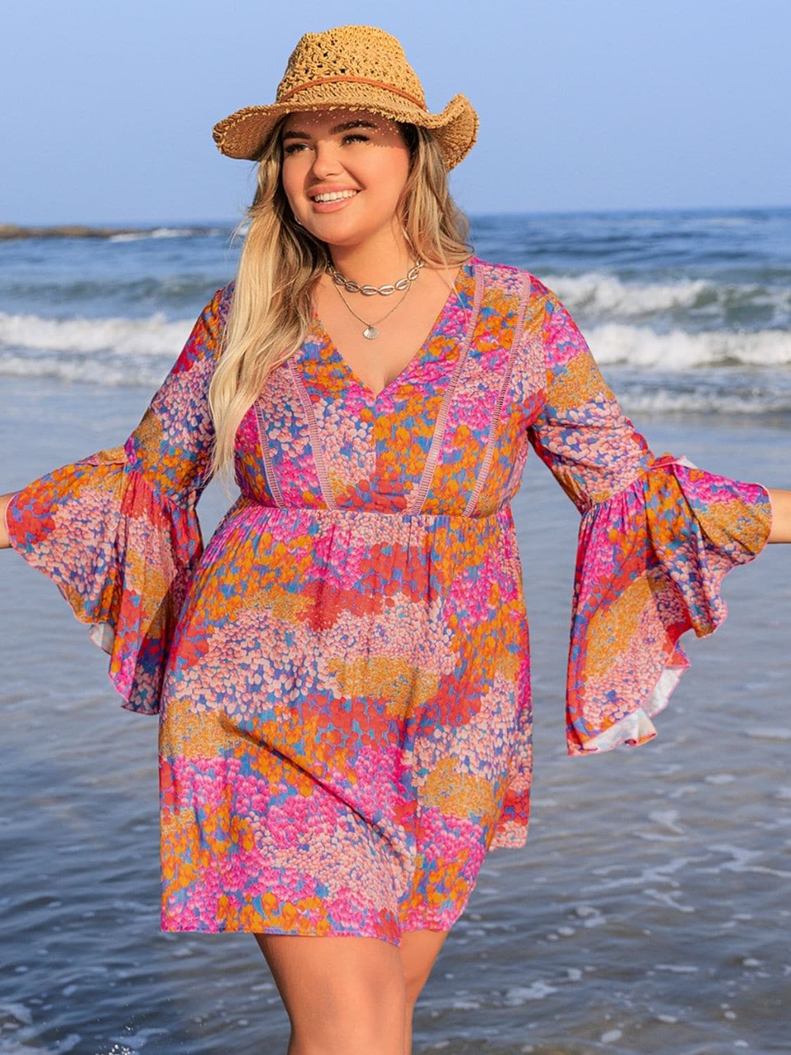 Plus Size Ruched Printed Long Sleeve Dress.