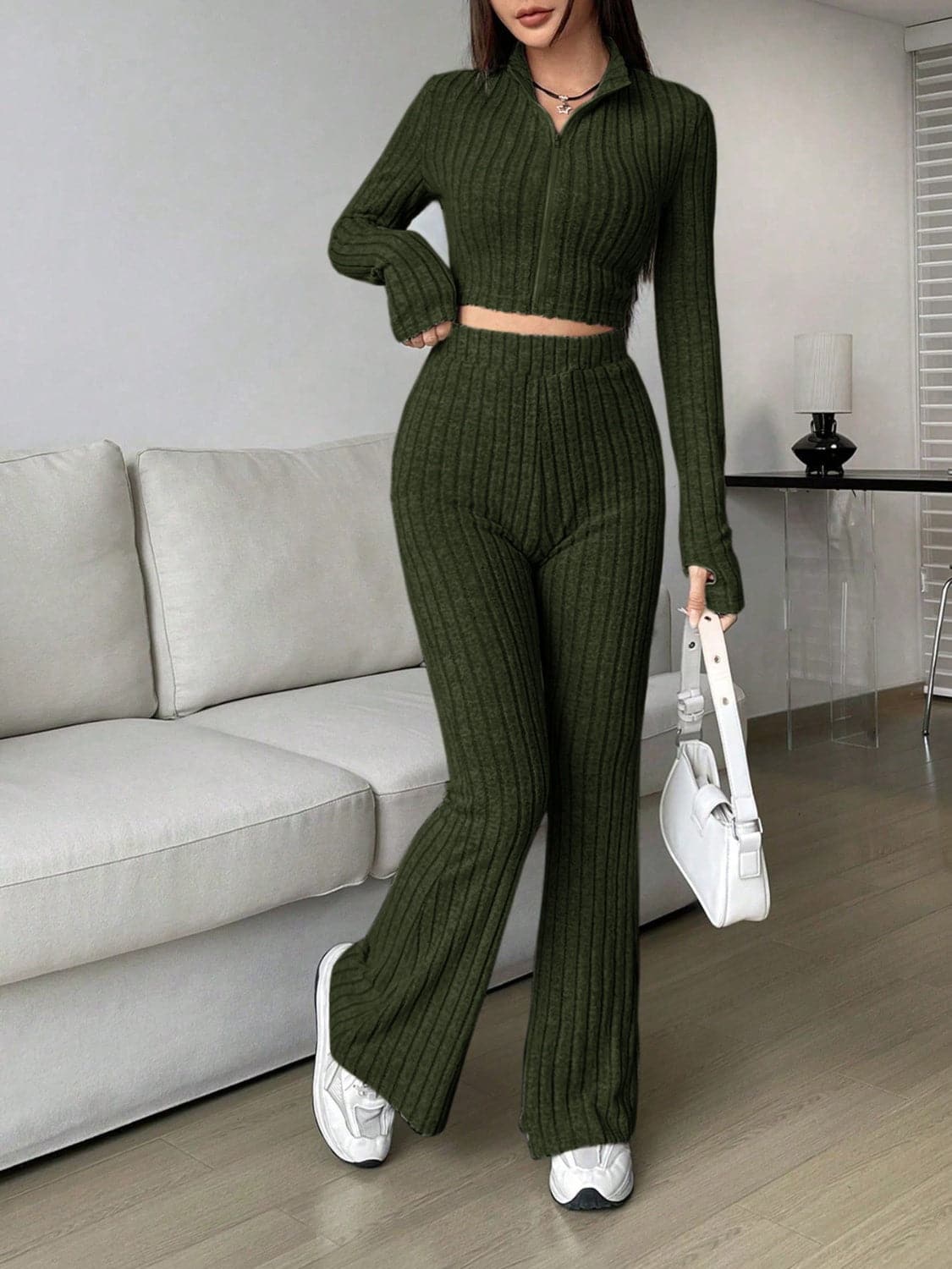 Zip Up Long Sleeve Top and Pants SetFeatures: Basic style
Number of pieces: Two-piece
Stretch: Slightly stretchy
Material composition: 95% polyester, 5% elastane
Care instructions: Machine wash cold. TLove Salve Long Sleeve TopTwo-Piece Sets