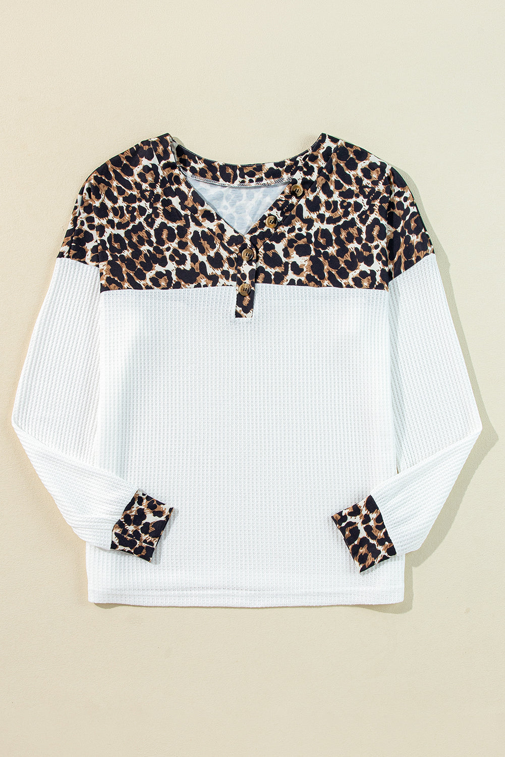 Stylish white leopard print waffle knit top with button details