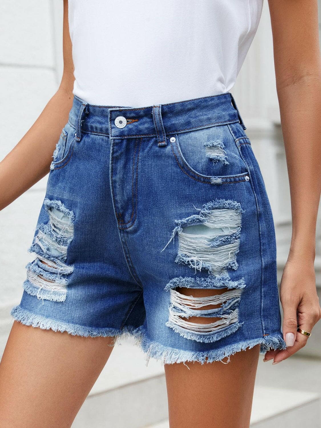 Distressed Raw Hem Denim Shorts.