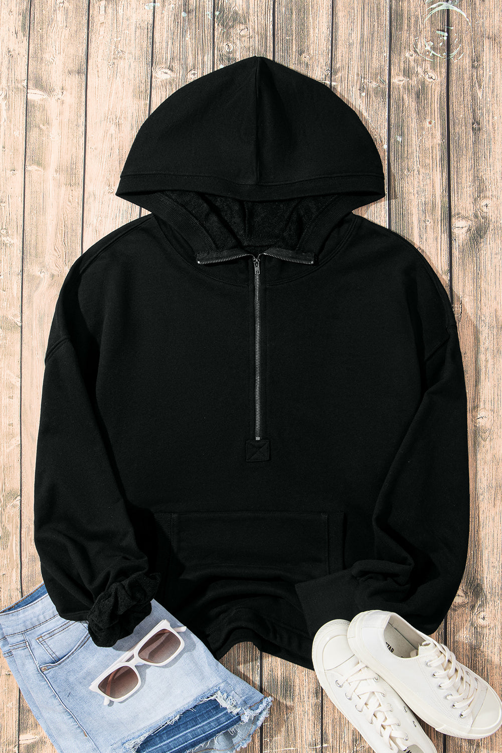 Cozy black oversized hoodie with kangaroo pocket and half zipper