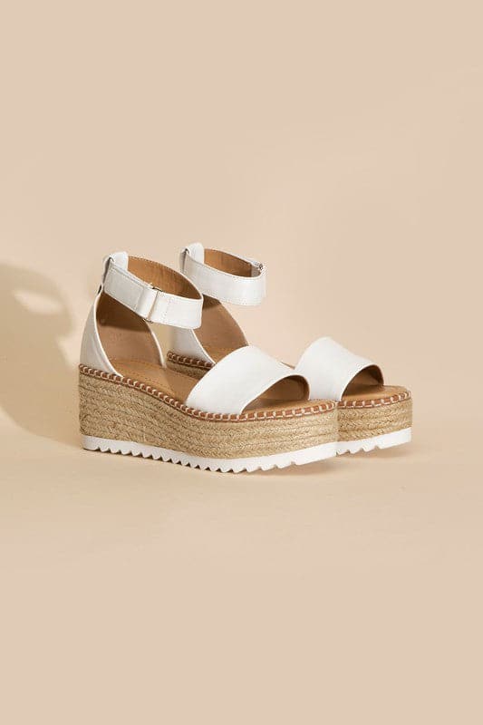 TUCKIN-S PLATFORM SANDALS.