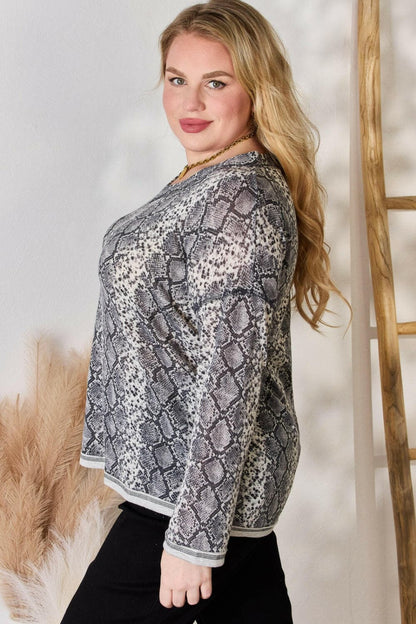 Hailey & Co Full Size Snakeskin V-Neck Long Sleeve TopStep Into the Spotlight with Hailey &amp; Co
 Embrace your boldness and stay on trend with the Hailey &amp; Co Full Size Snakeskin V-Neck Long Sleeve Top. This stunnLove Salve -Neck Long Sleeve Topcloseout